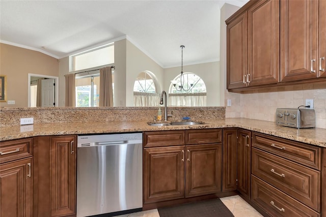 kitchen featuring tasteful backsplash, vaulted ceiling, sink, dishwasher, and a chandelier