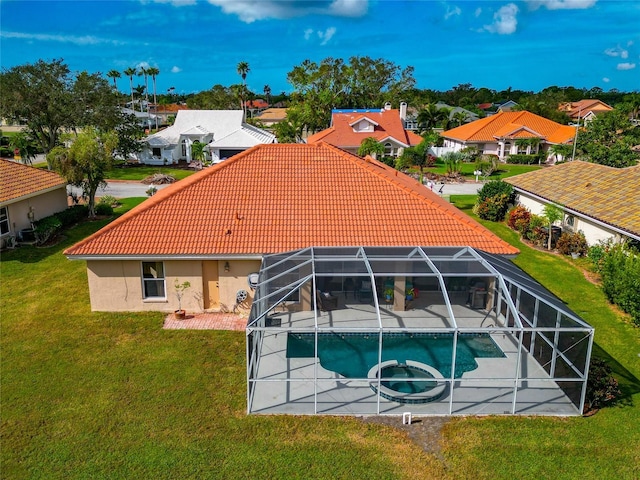 rear view of property with stucco siding, a tile roof, a residential view, an outdoor pool, and a patio area