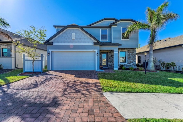 view of front of home with a garage and a front yard