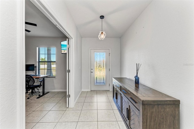 entrance foyer featuring light tile patterned floors and ceiling fan