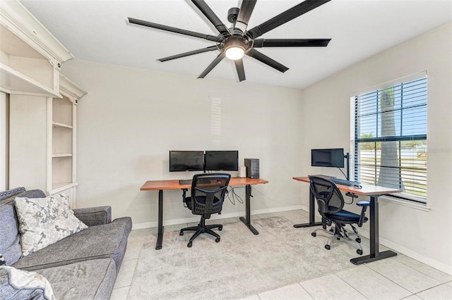 office area featuring light tile patterned floors and ceiling fan