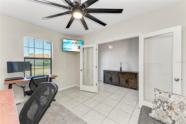 tiled office space with ceiling fan and french doors