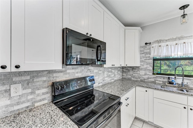 kitchen with decorative backsplash, black appliances, sink, light stone countertops, and white cabinetry