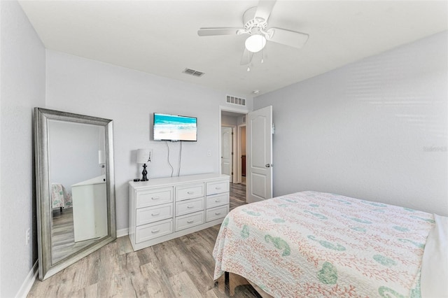 bedroom with light hardwood / wood-style flooring and ceiling fan