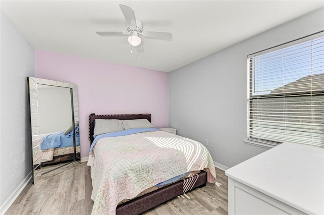 bedroom featuring light hardwood / wood-style flooring and ceiling fan