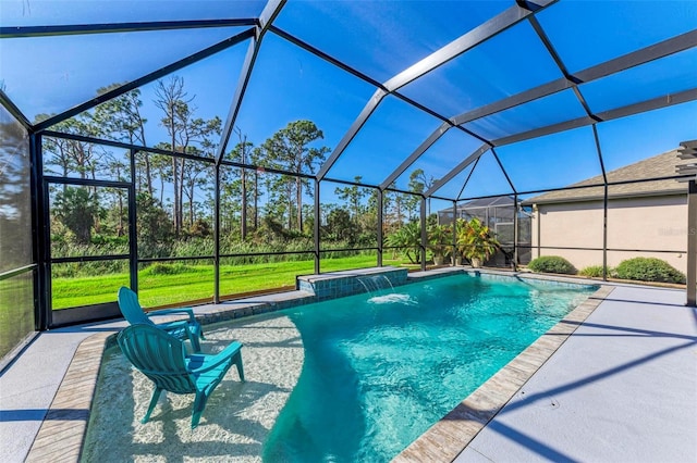 view of pool featuring glass enclosure, pool water feature, and a patio area