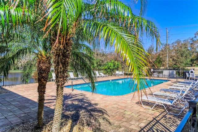 view of swimming pool featuring a patio area