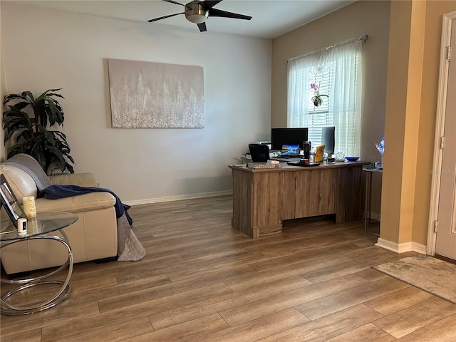 home office featuring ceiling fan and wood-type flooring