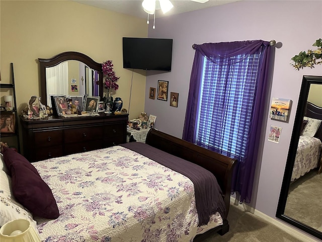 bedroom featuring ceiling fan and light carpet