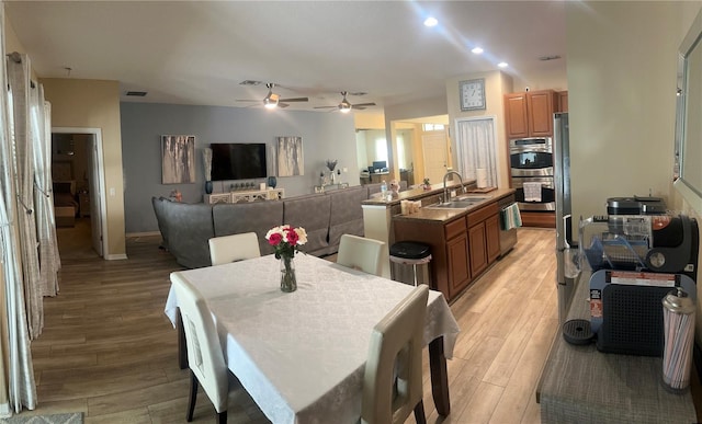 2271 50th Street Cir E, Palmetto, FL 34221 - dining area featuring ceiling fan and light wood-type flooring