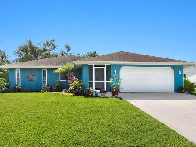 single story home featuring a garage and a front lawn