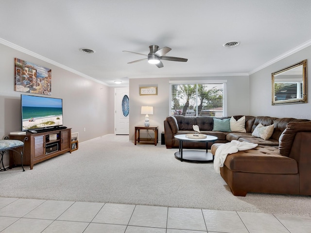 carpeted living room with ornamental molding and ceiling fan