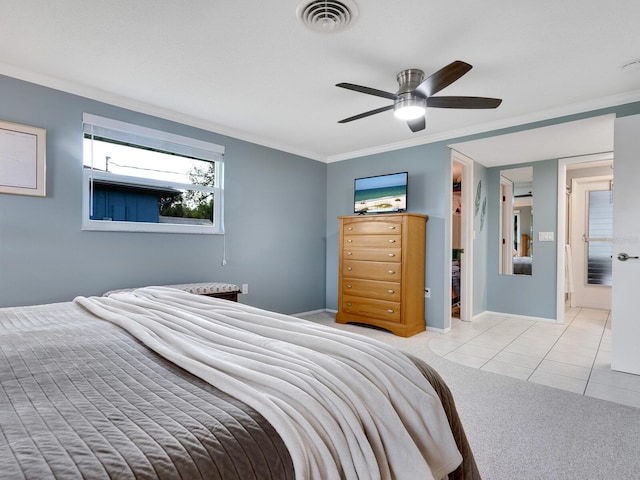 carpeted bedroom featuring ceiling fan and crown molding