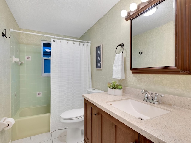 full bathroom featuring toilet, vanity, a textured ceiling, and tile patterned floors