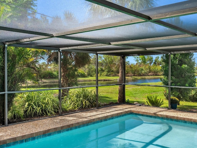 view of pool with a lanai and a water view