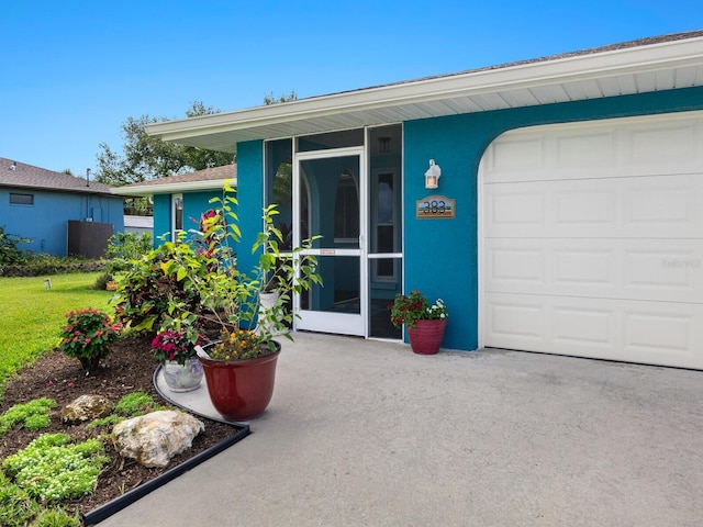 entrance to property featuring a garage