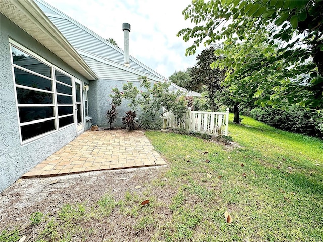 view of yard featuring a patio and fence