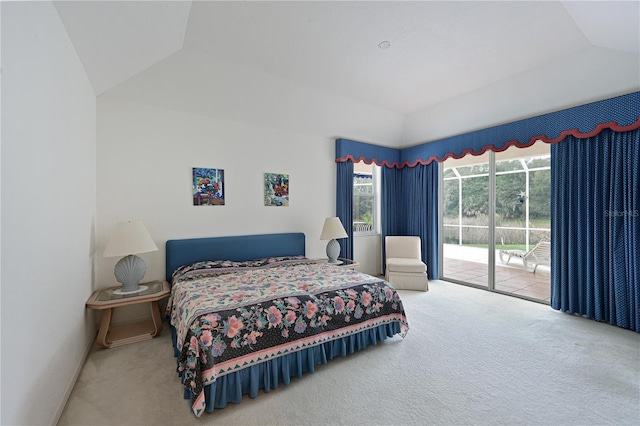 bedroom with access to exterior, carpet flooring, and vaulted ceiling