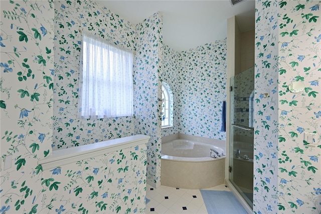 bathroom featuring tile patterned flooring and shower with separate bathtub