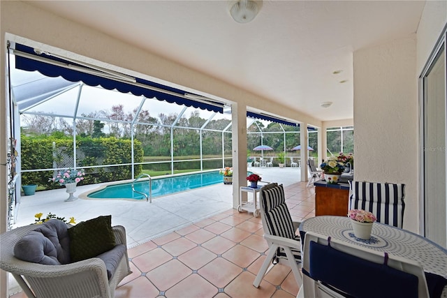 view of swimming pool featuring a patio and glass enclosure