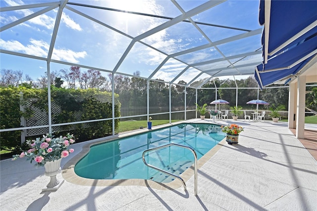 view of pool with a lanai and a patio area