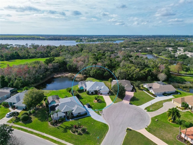 birds eye view of property with a water view