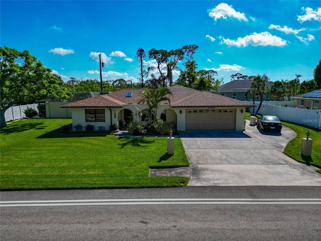 view of front of home featuring a garage and a front lawn