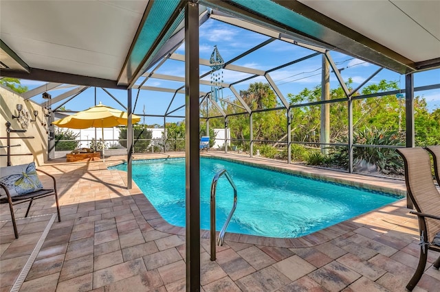 view of swimming pool with a patio and glass enclosure