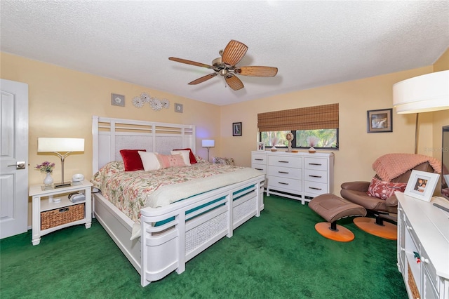 bedroom featuring ceiling fan, a textured ceiling, and dark colored carpet