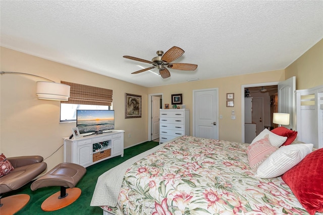 carpeted bedroom with ceiling fan and a textured ceiling