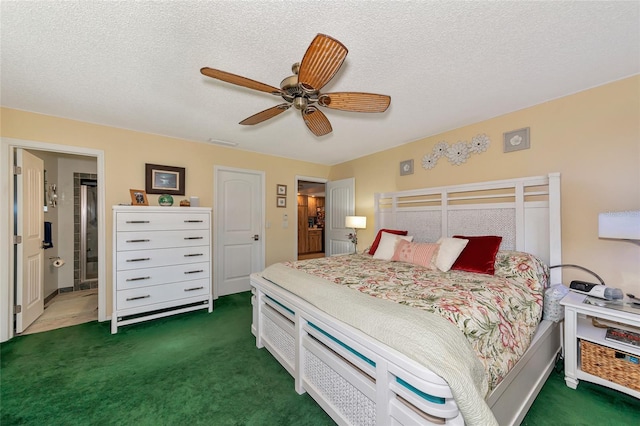 bedroom with connected bathroom, ceiling fan, a textured ceiling, and dark colored carpet