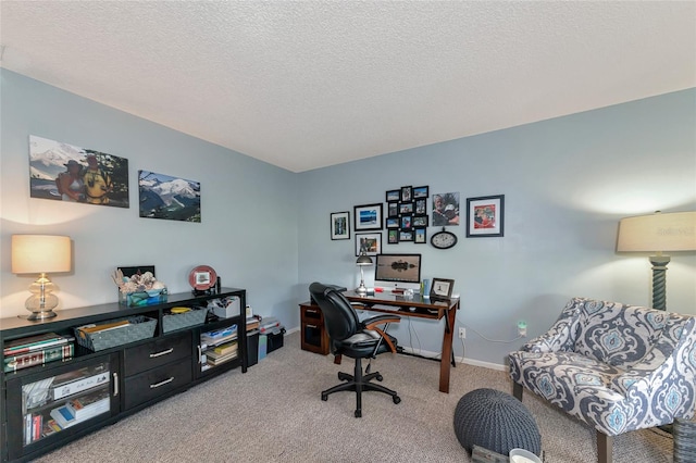 carpeted home office with a textured ceiling