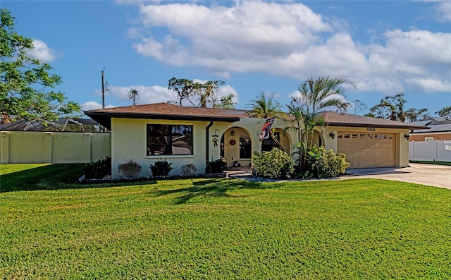 view of front of house featuring a front lawn and a garage