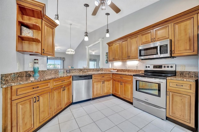 5240 Hyland Hills Ave Unit 1421, Sarasota, FL 34241 - kitchen featuring appliances with stainless steel finishes, a ceiling fan, brown cabinets, and lofted ceiling
