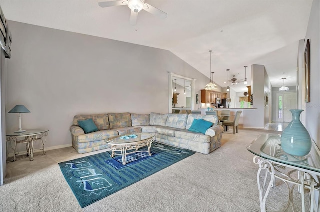 living room featuring ceiling fan, light carpet, and lofted ceiling