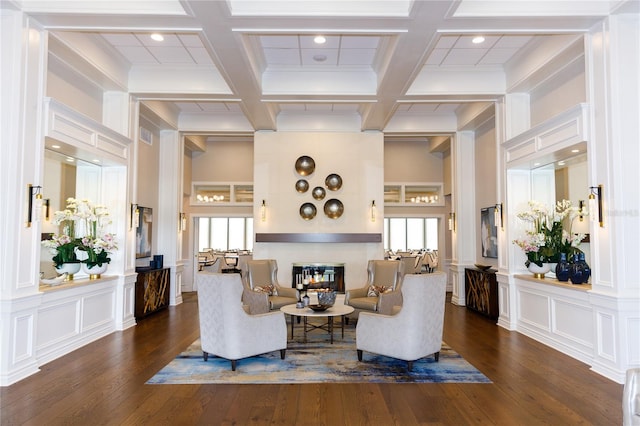 living room with beamed ceiling, dark hardwood / wood-style flooring, and coffered ceiling