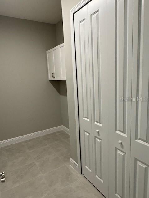 laundry room with light tile patterned floors