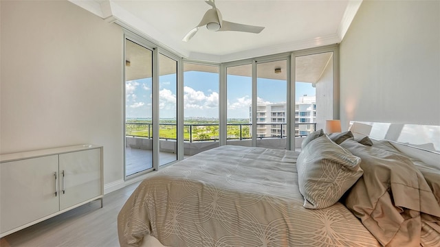 bedroom featuring access to outside, crown molding, floor to ceiling windows, ceiling fan, and light hardwood / wood-style flooring