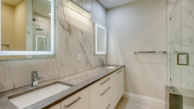 bathroom with vanity and a shower with shower door