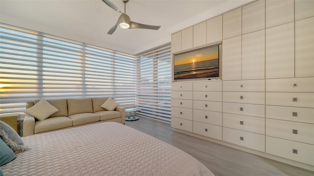 bedroom with ceiling fan and light wood-type flooring