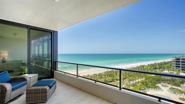 balcony with a beach view and a water view