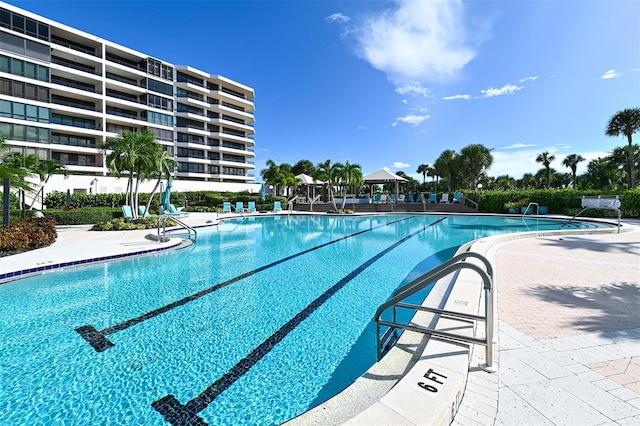 view of swimming pool with a patio area