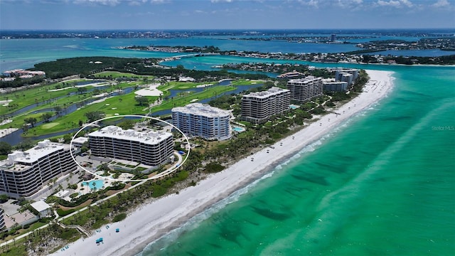 drone / aerial view featuring a view of the beach and a water view