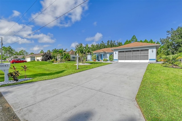 single story home with a front yard and a garage