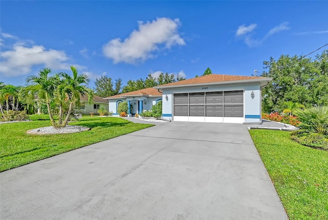 view of front facade with a garage and a front yard