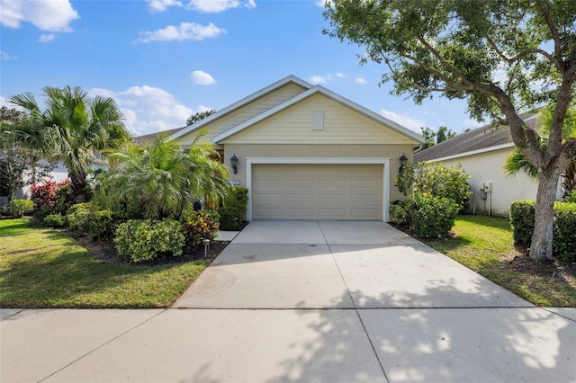 view of front facade featuring a front yard and a garage