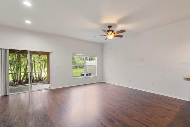 empty room featuring ceiling fan and dark hardwood / wood-style flooring