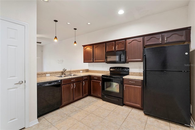 kitchen with black appliances, decorative light fixtures, light tile patterned flooring, and sink