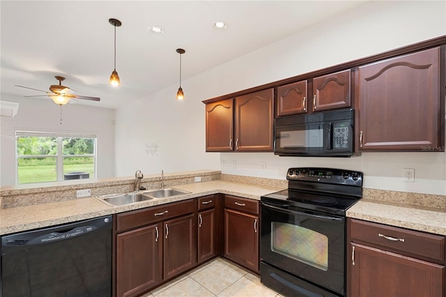 kitchen with ceiling fan, sink, pendant lighting, light tile patterned flooring, and black appliances