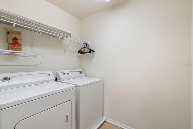 laundry room featuring washing machine and clothes dryer